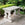 French Provincial Outdoor Center or Console Table Featuring Dolphin Supports and Dark Stone Top