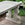 French Provincial Outdoor Center or Console Table Featuring Dolphin Supports and Dark Stone Top